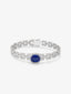 Pulsera de oro blanco de 18K con zafiro azul royal en talla oval de 6 cts y diamantes blancos en talla brillante de 3,15 cts