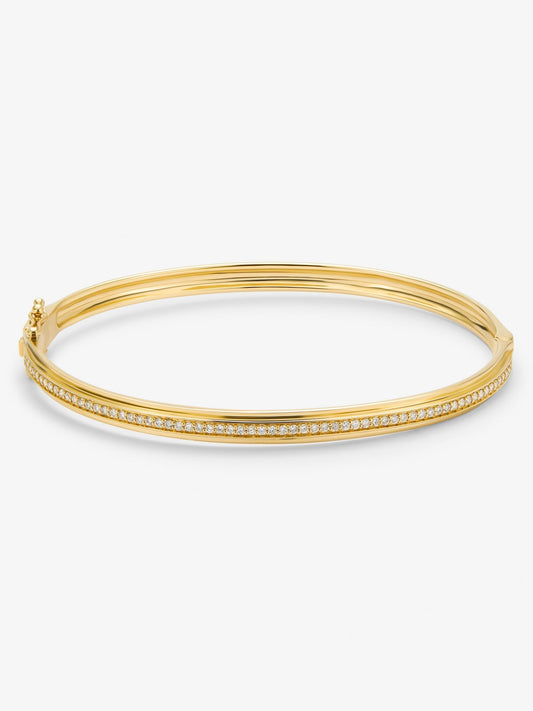 Pulsera rígida de oro amarillo de 18K con 64 diamantes en talla brillante con un total de 0,38 cts