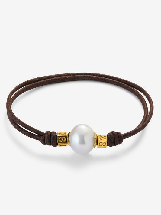 Pulsera one con perla australiana y detalles de oro amarillo de 18K