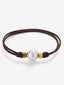 Pulsera one con perla australiana y detalles de oro amarillo de 18K