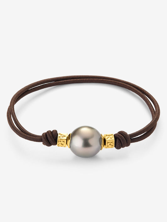 Pulsera one con perla tahití y detalles de oro amarillo de 18K