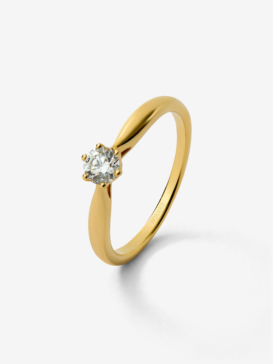 Anillo solitario 3006 de oro amarillo de 18K con diamante en talla brillante de 0,25 cts 