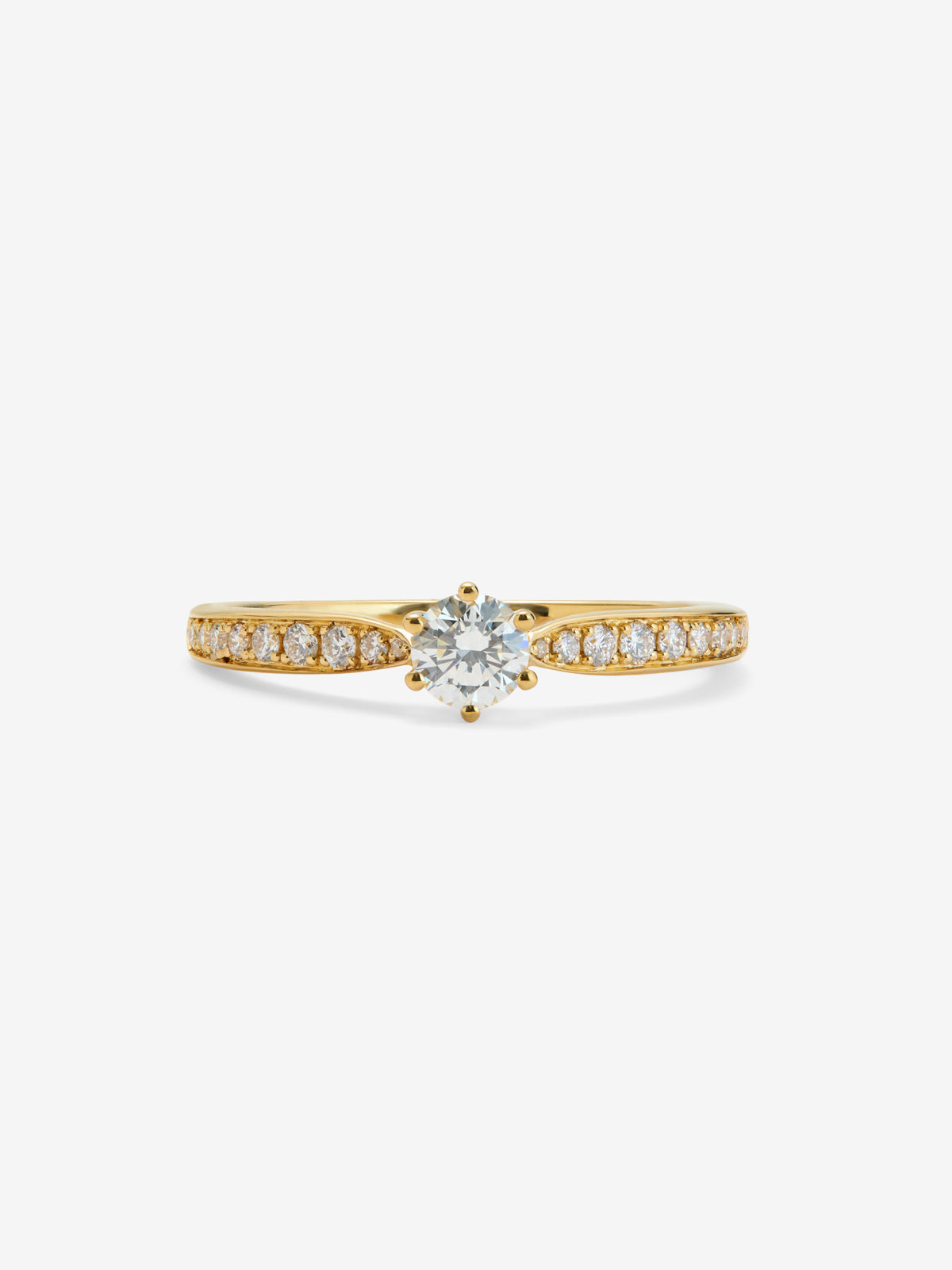 Anillo solitario 3006 de oro amarillo de 18K con diamante central en talla brillante de 0,25 cts y diamantes en talla brillante con un total de 0,13 cts