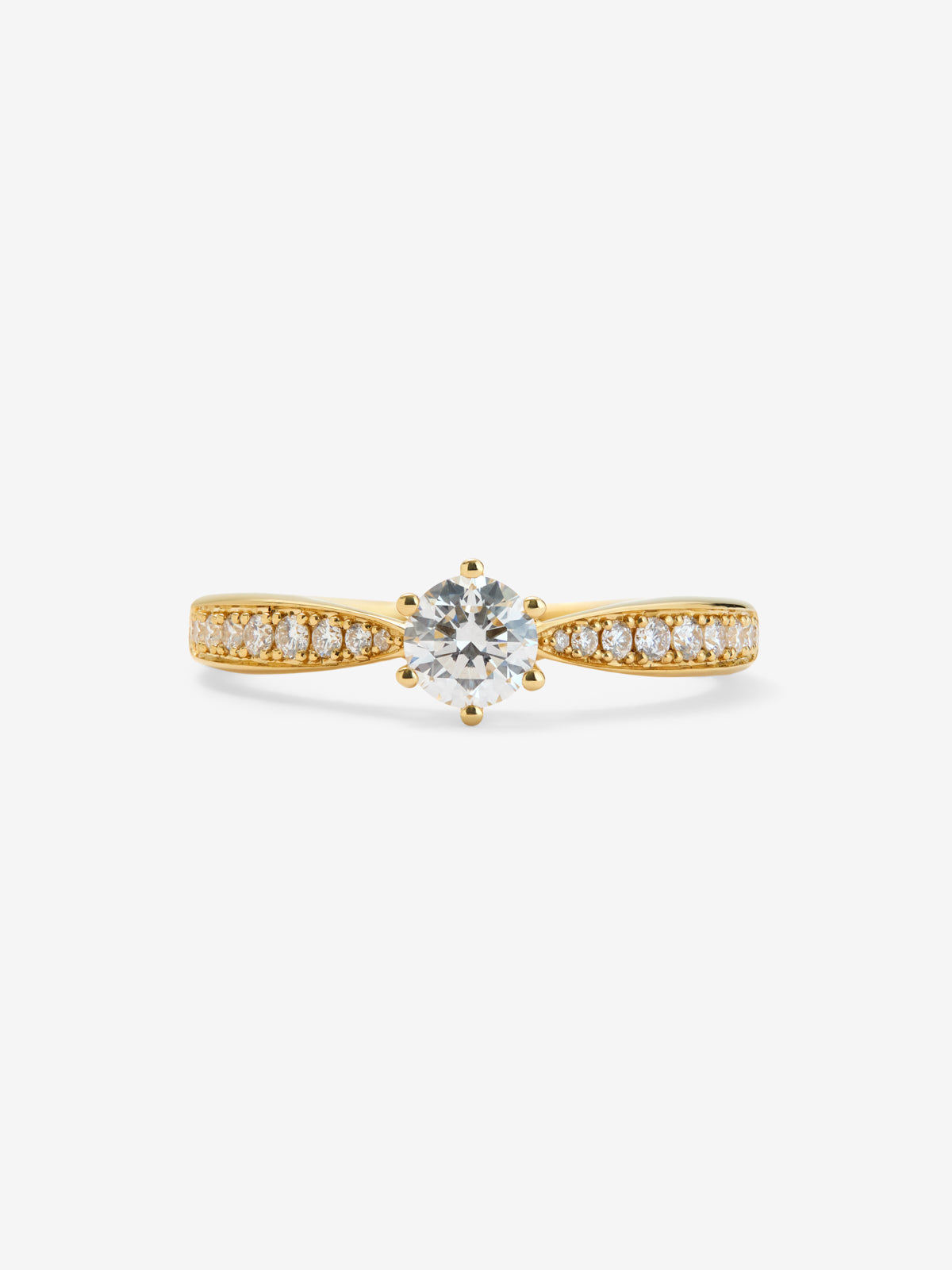 Anillo solitario 3006 de oro amarillo de 18K con diamante central en talla brillante de 0,30 cts y diamantes en talla brillante con un total de 0,15 cts
