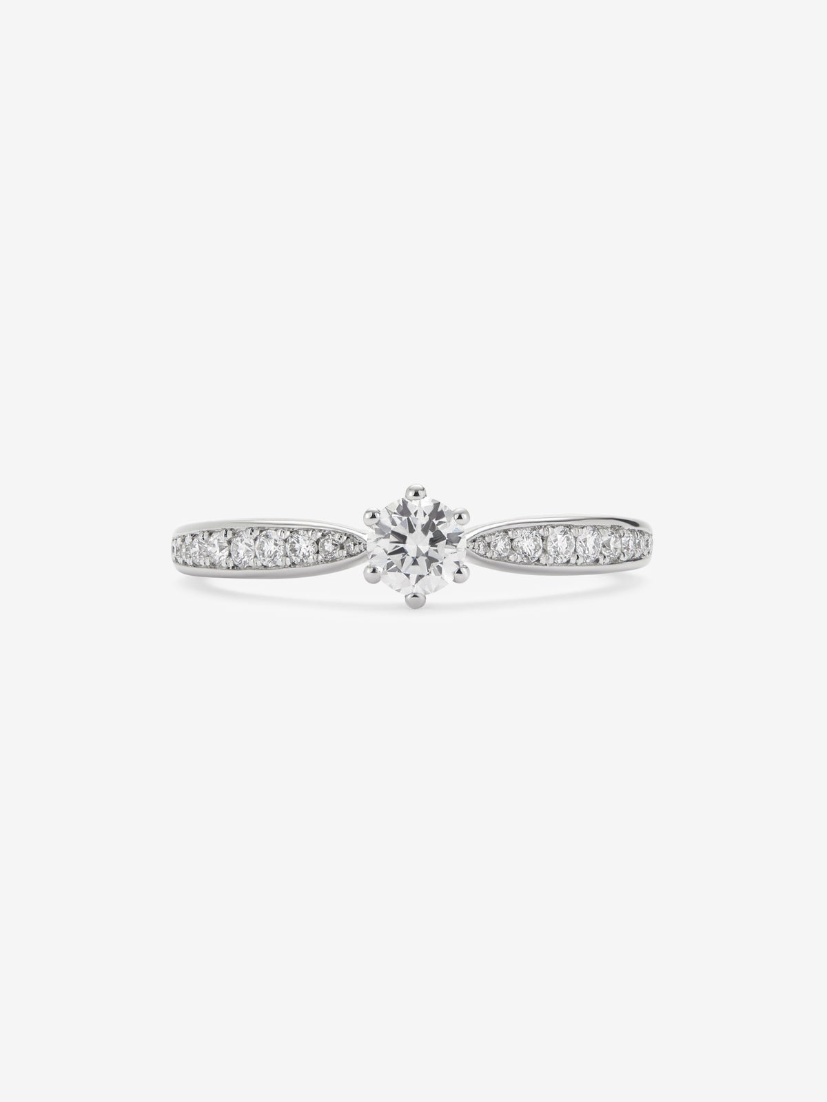 Anillo solitario de oro blanco de 18K con diamante central en talla brillante de 0,25 cts y diamantes en talla brillante con un total de 0,13 cts
