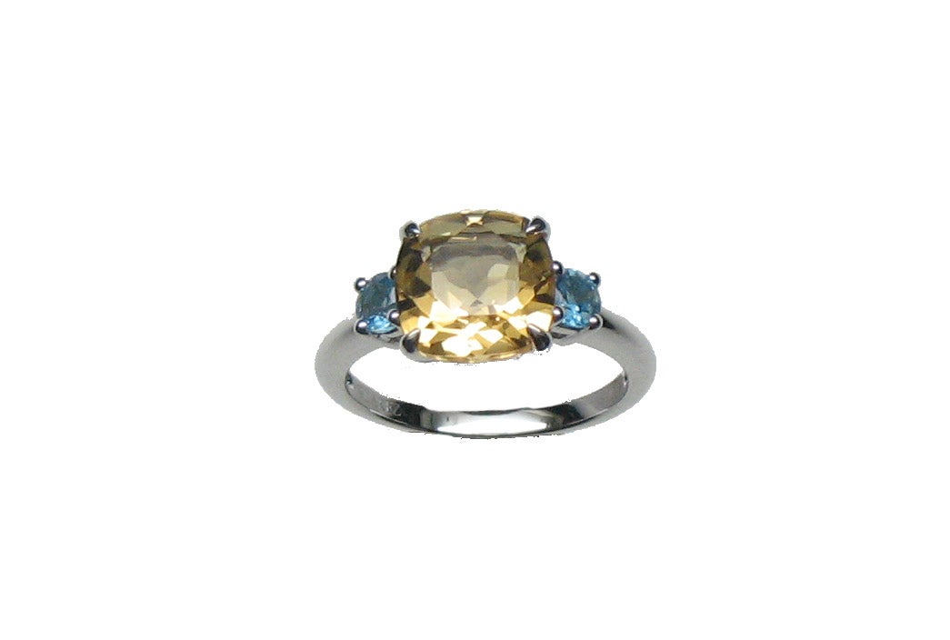 Anillo tresillo de plata 925 con cuarzo citrino amarillo y topacios azul swiss