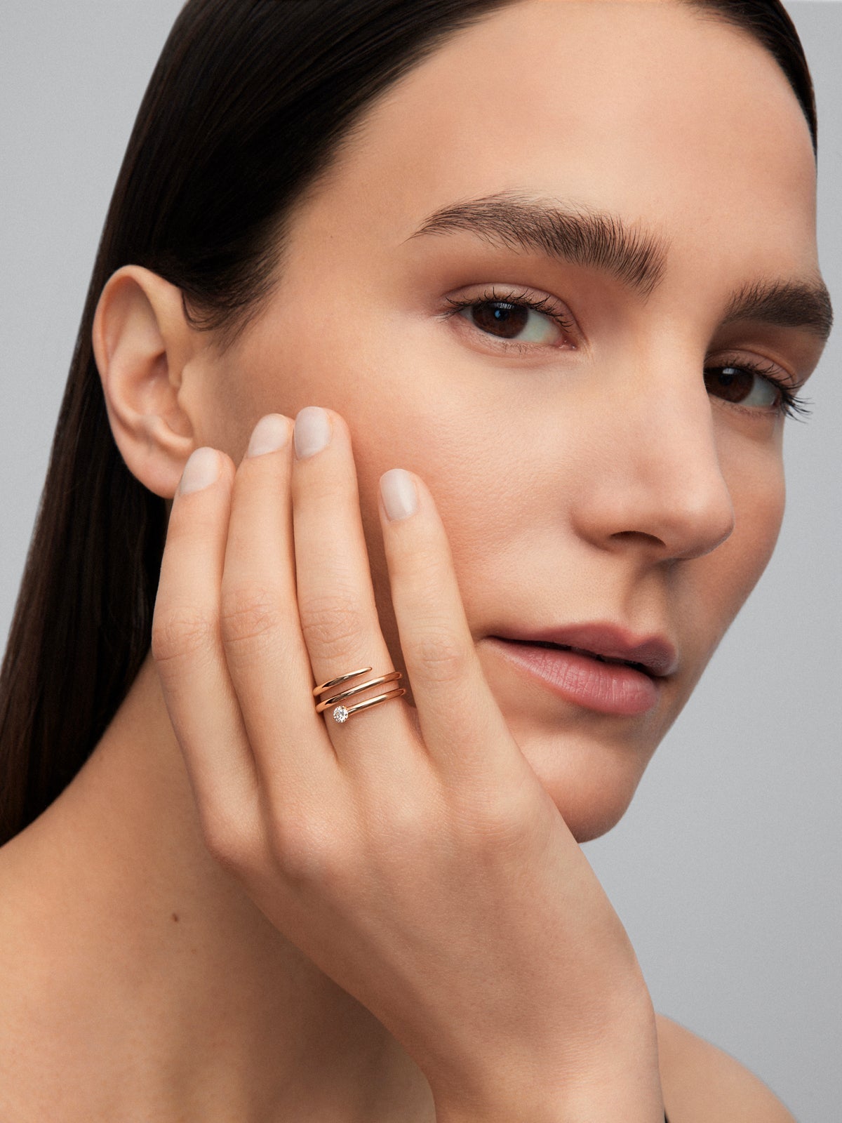 Anillo multibrazo de oro rosa de 18K con diamante en talla brillante de 0,13 cts