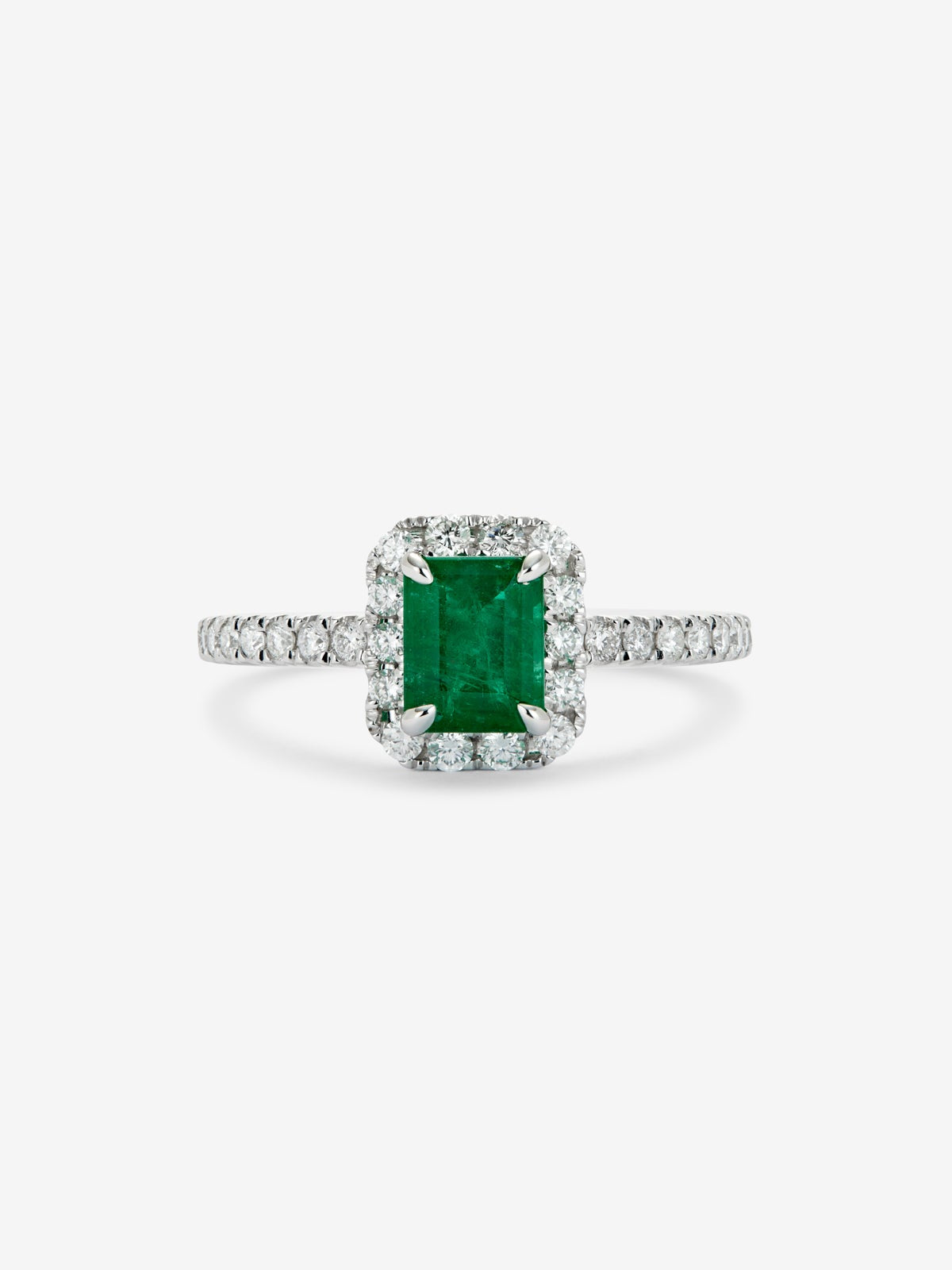 Anillo de oro blanco de 18K con esmeralda verde en talla esmeralda de 0,4 cts y diamantes blancos en talla brillante de 0,32 cts