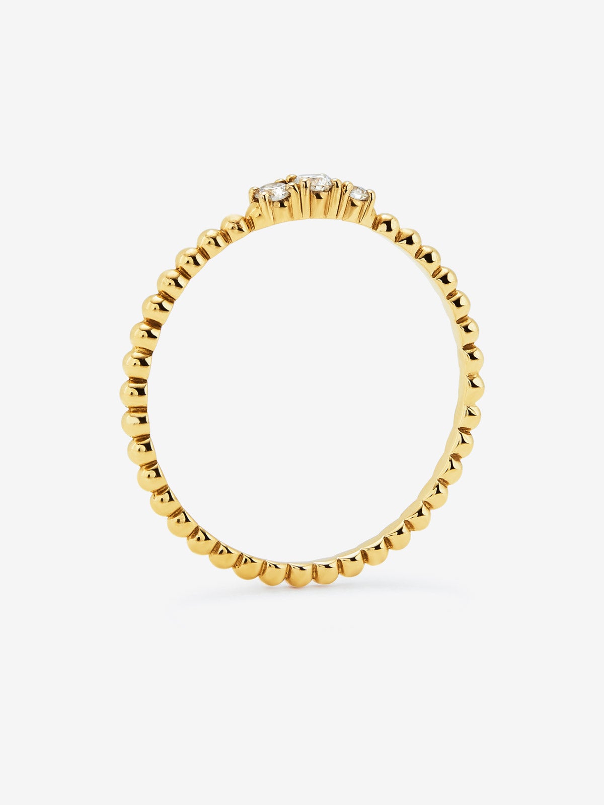 Anillo tresillo de oro amarillo de 18K con 3 diamantes en talla brillante con un total de 0,08 cts