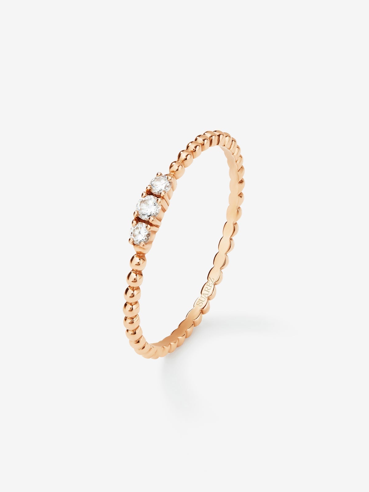 Anillo tresillo de oro rosa de 18K con 3 diamantes en talla brillante con un total de 0,08 cts