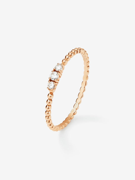 Anillo tresillo de oro rosa de 18K con 3 diamantes en talla brillante con un total de 0,08 cts