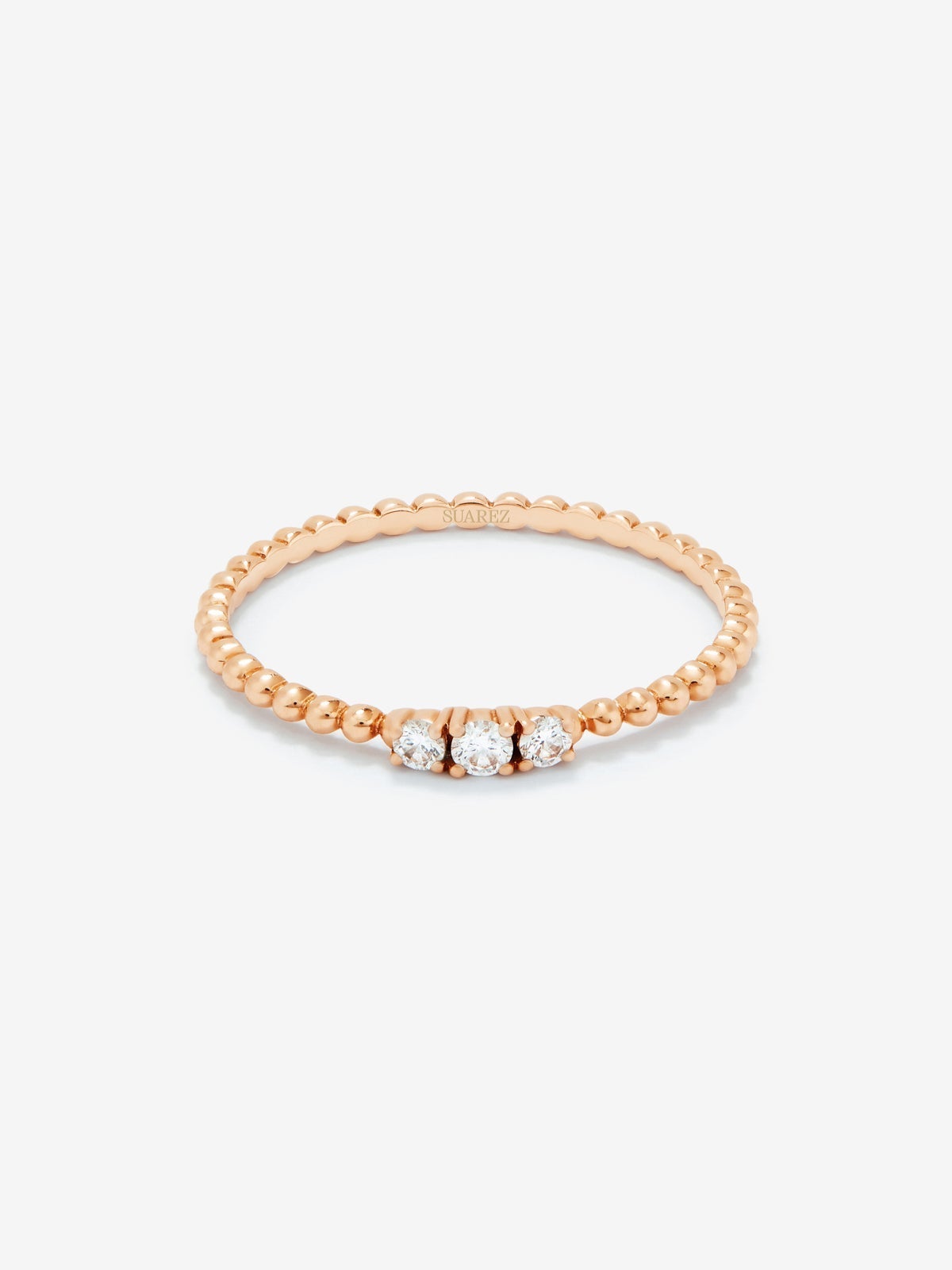Anillo tresillo de oro rosa de 18K con 3 diamantes en talla brillante con un total de 0,08 cts
