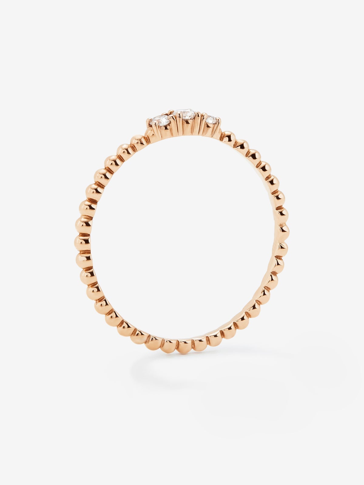 Anillo tresillo de oro rosa de 18K con 3 diamantes en talla brillante con un total de 0,08 cts