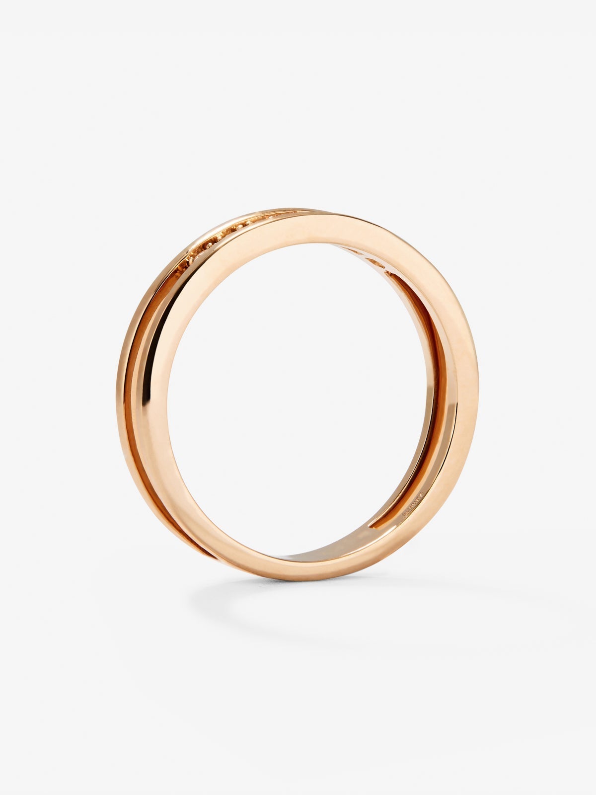 Anillo doble de oro rosa de 18K con 7 diamantes en talla brillante con un total de 0,1 cts