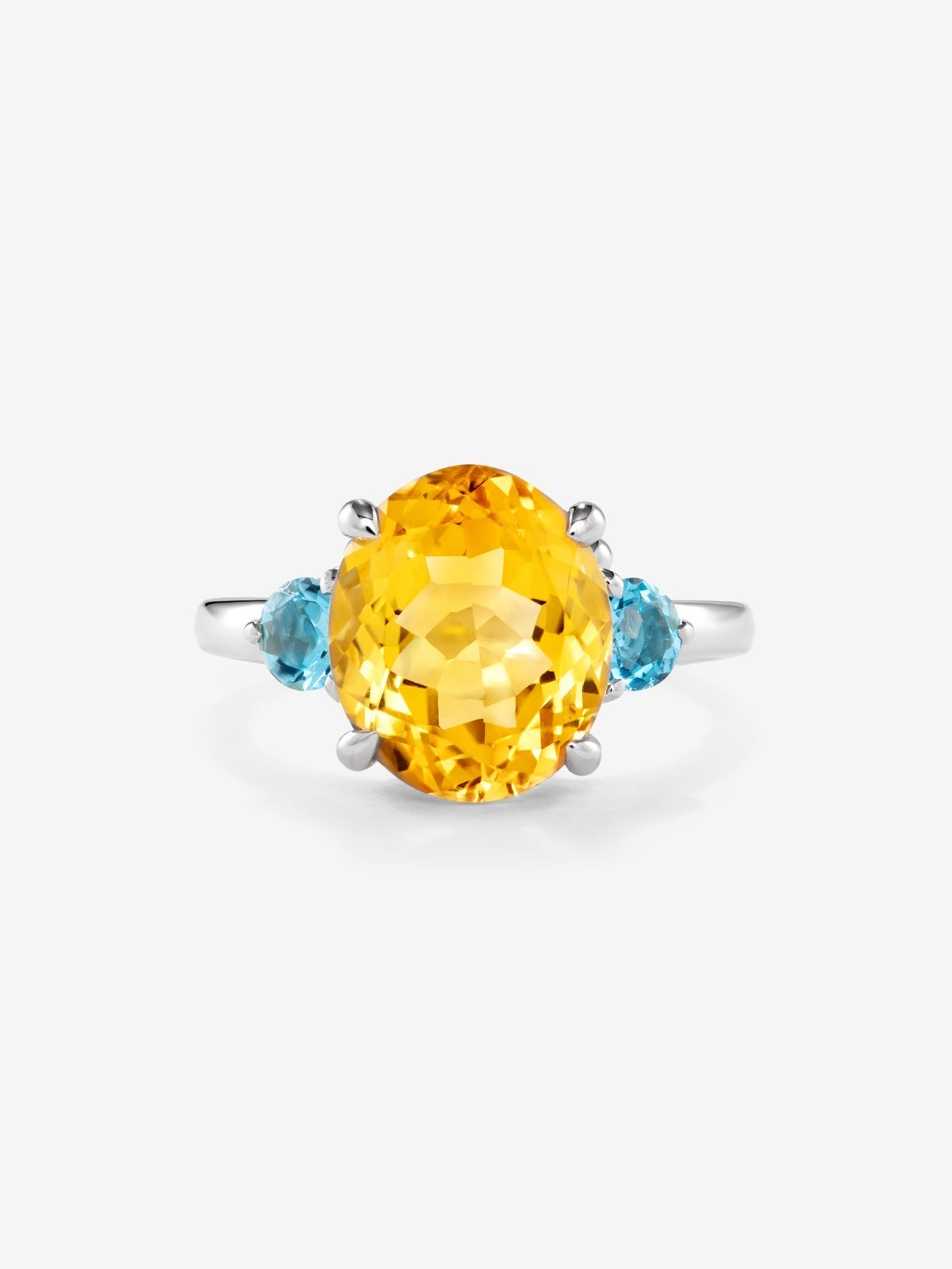 Anillo tresillo de plata 925 con cuarzo citrino en talla oval y 2 topacios azul swiss en talla brillante