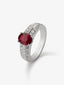 Anillo de oro blanco de 18K con rubí en talla oval de 1,151 cts y 32 diamantes en talla brillante con un total de 0,62 cts