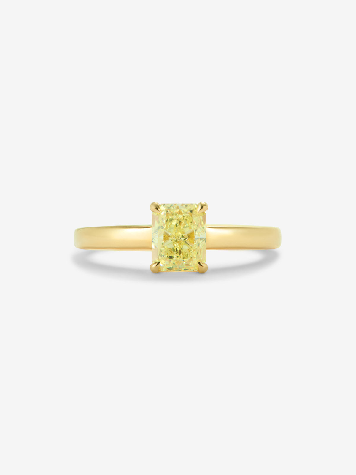 Anillo solitario de oro amarillo de 18K con diamante central Fancy Yellow en talla radiant de 0,70 cts 