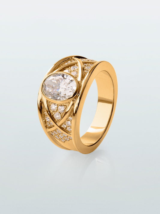 Anillo de oro amarillo de 18K con diamante central en talla oval de 1,5 cts y 40 diamantes en talla brillante con un total de 0,4 cts