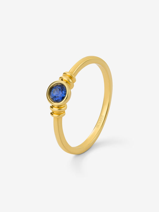 Anillo de oro amarillo de 18K con zafiro azul en talla brillante de 0,15 cts