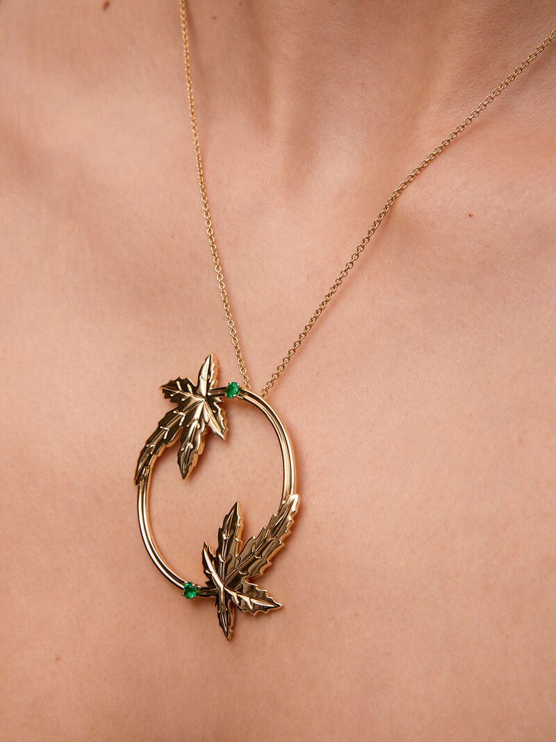 18K yellow gold pendant with two brilliant-cut emeralds totaling 0.29 cts, in a maple leaf design image number 3