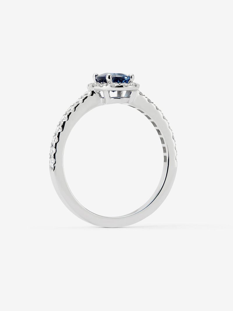 18K white gold ring with a 0.89 ct oval-cut blue sapphire and a brilliant-cut diamond border totaling 0.34 cts image number 2