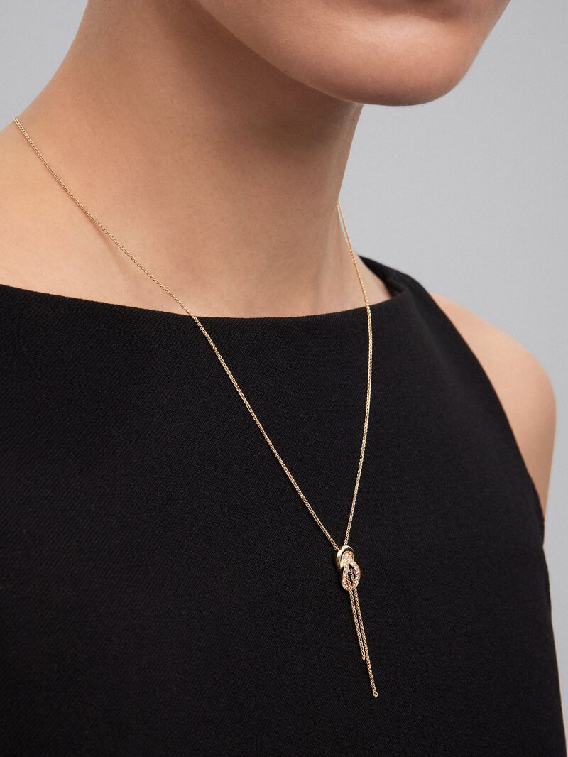 18K yellow gold pendant with 26 brilliant-cut diamonds with a total of 0.16 cts and a knot shape image number 3