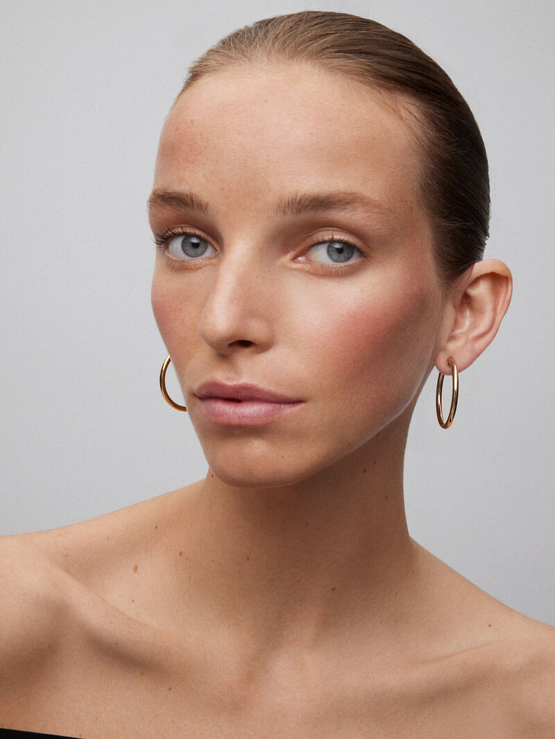 Large Smooth Hoop Earrings in 18K Yellow Gold image number 1
