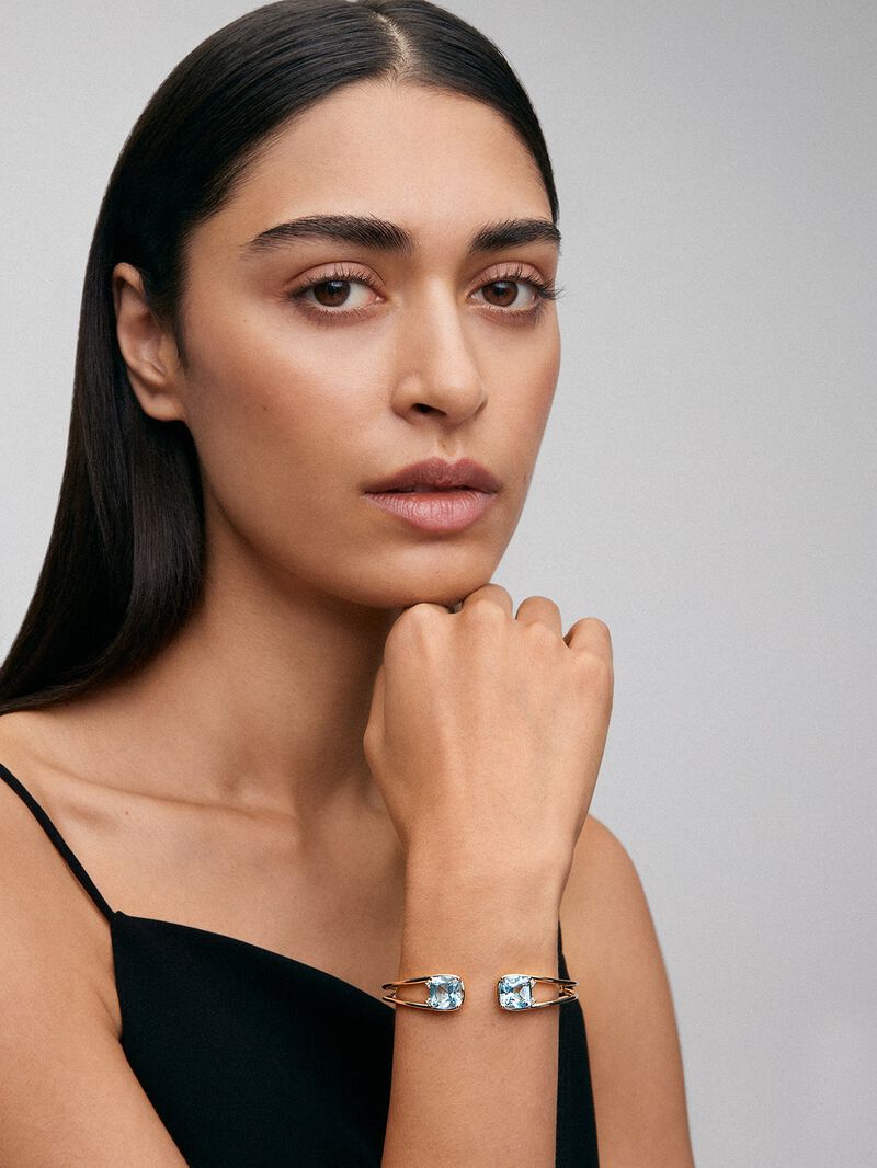 Rigid 18K yellow gold bracelet with 2 sky blue topazes in cushion cut with a total of 0.12 cts image number 3