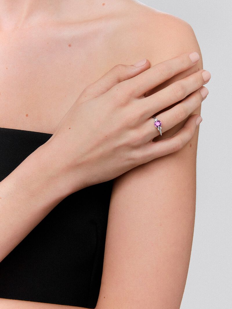18kt white gold three-stone ring with a central 1.21cts cushion-cut pink sapphire and diamonds. image number 1