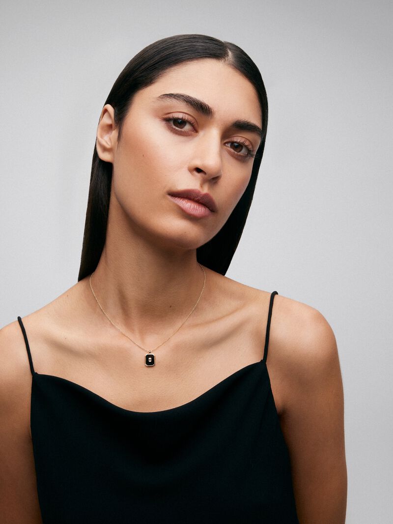 18K yellow gold pendant with 1.45 ct black onyx and 0.1 ct emerald-cut white diamond image number 1