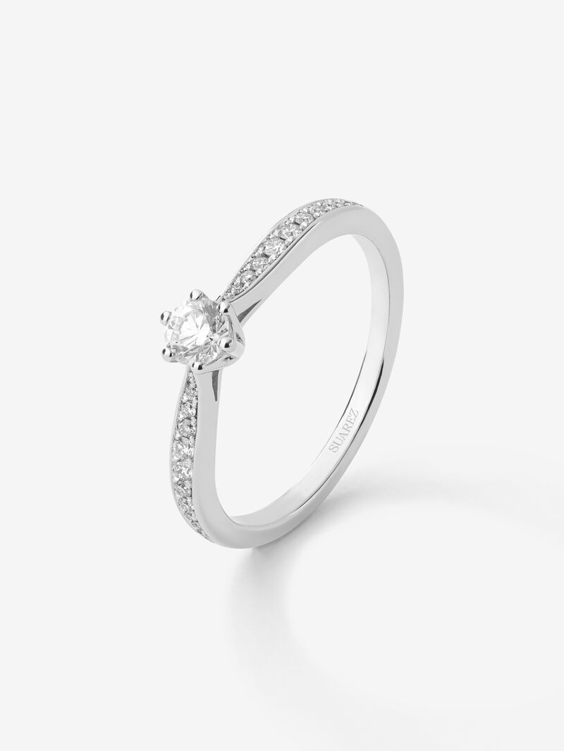 Solitaire ring in 18K white gold with a central 0.20-carat brilliant-cut diamond and additional diamonds totaling 0.10 cts image number 0