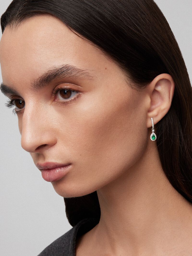18K white gold earrings with green emeralds in 0.73 cts and white diamonds in bright 0.54 cts image number 1