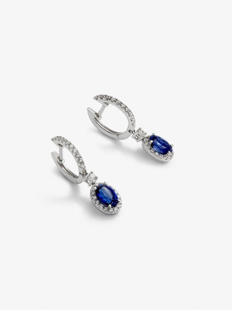 18K white gold earrings with 2 oval-cut blue sapphires with a total of 0.69 cts and 36 brilliant-cut diamonds with a total of 0.13 cts image number 1