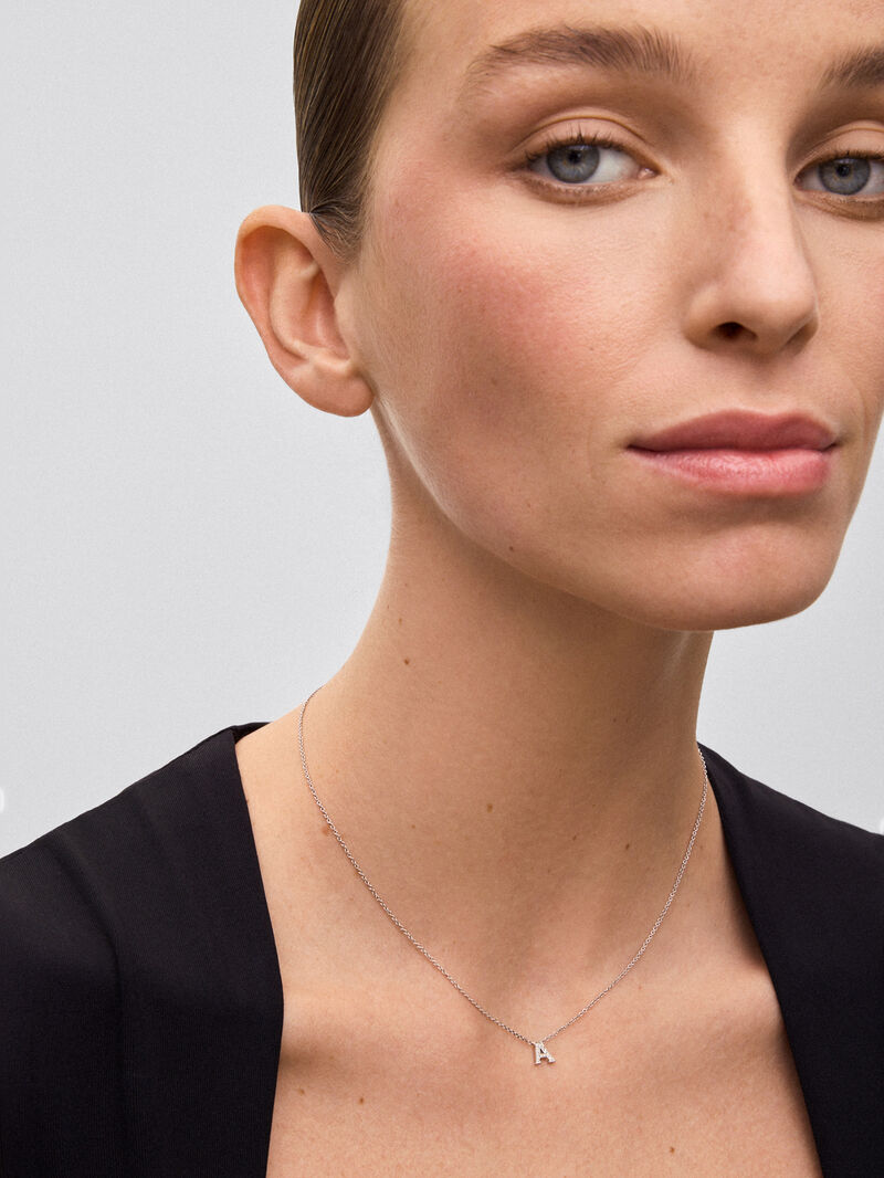 Pendant necklace with small initial in 18K white gold and diamonds. image number 1
