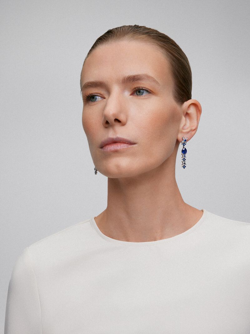 18k white gold earrings with royal blue sapps in pear size 4.05 cts, blue sapphires in bright size 1.27 cts and white diamonds in a bright size of 0.5 cts image number 3
