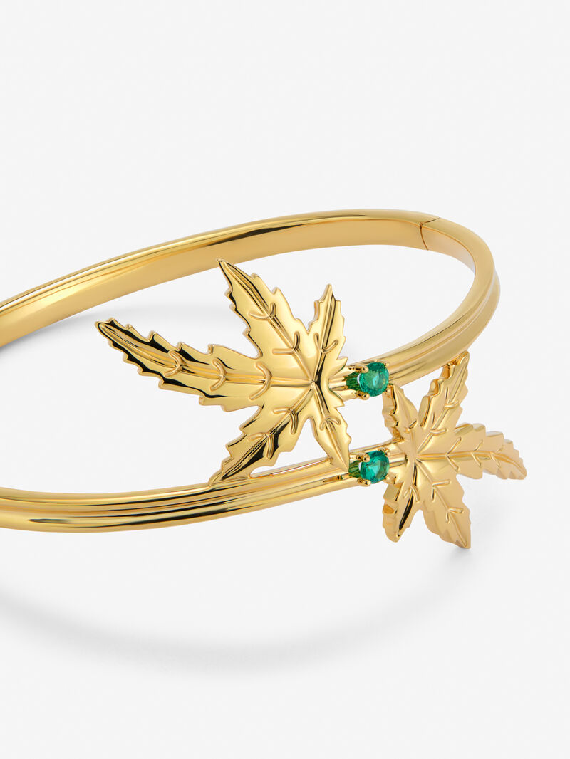 18K yellow gold bracelet with two brilliant-cut emeralds totaling 0.23 cts, in a maple leaf design. image number 2