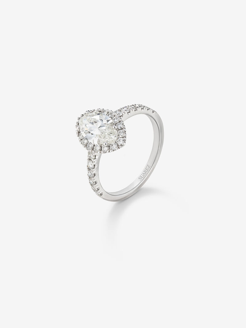 18K white gold solitaire ring with marquise-cut diamond and diamond halo image number 0