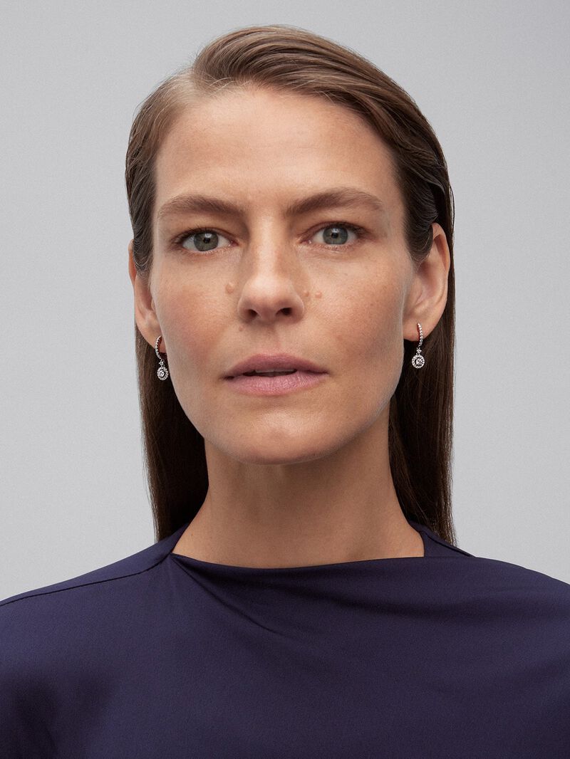 Solitaire pendant hoop earrings with 18K white gold rim encrusted with diamonds. image number 1