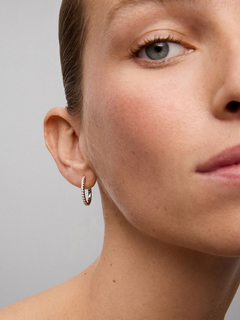 Thin hoop earrings made of 18K white gold with diamonds image number 3