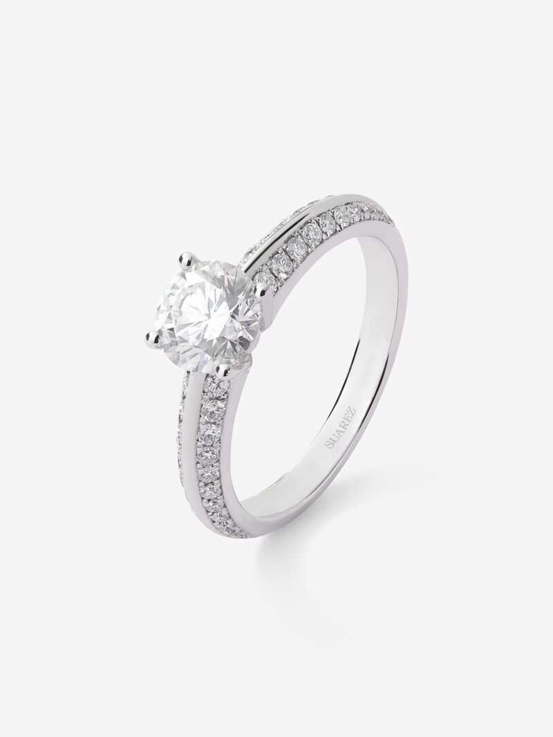 Solitaire ring in 18K white gold with a 1-carat central diamond and additional brilliant-cut diamonds totaling 0.33 cts image number 0