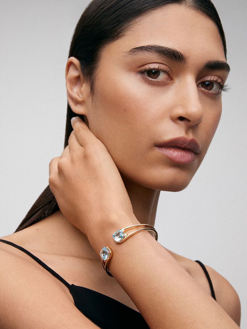 Rigid 18K yellow gold bracelet with 2 sky blue topazes in cushion cut with a total of 0.12 cts image number 1