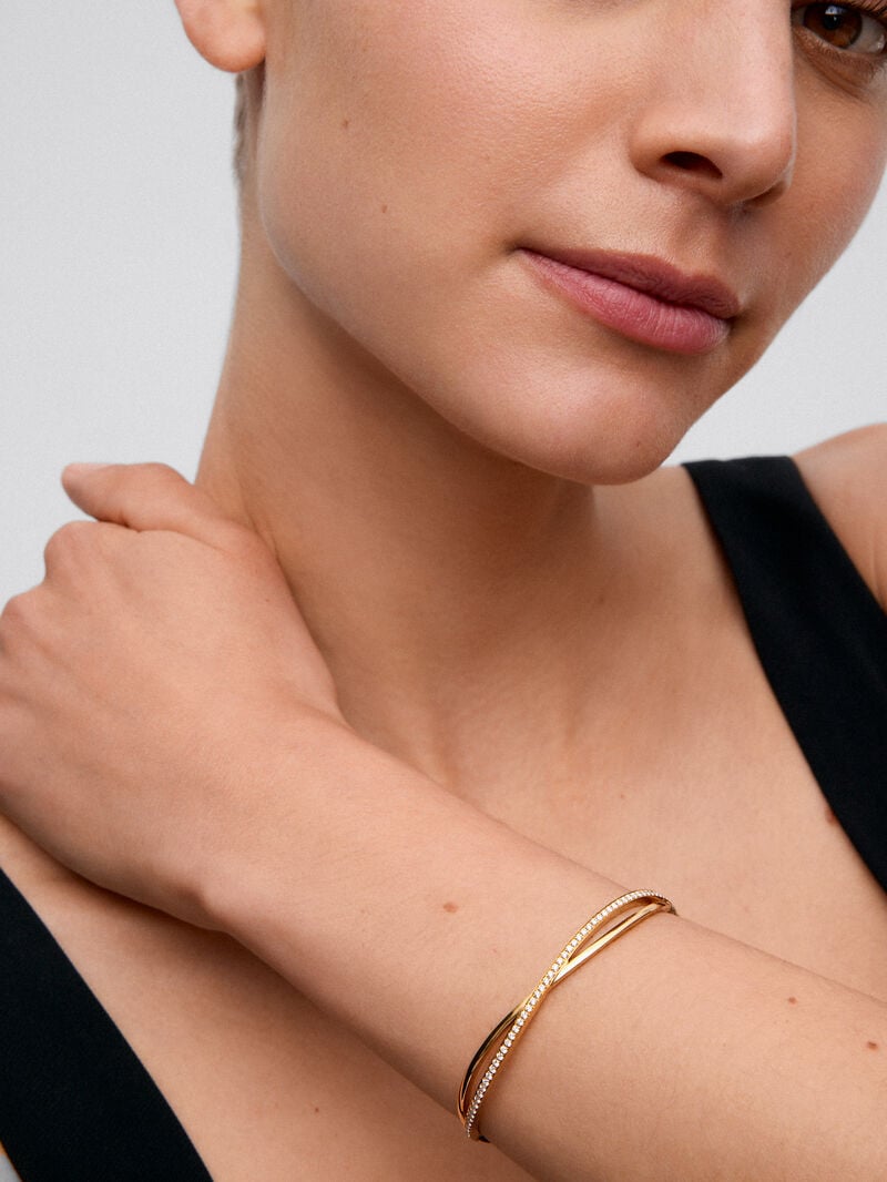 Rigid yellow gold bracelet of 18k with white diamonds in 0.74 cts image number 5