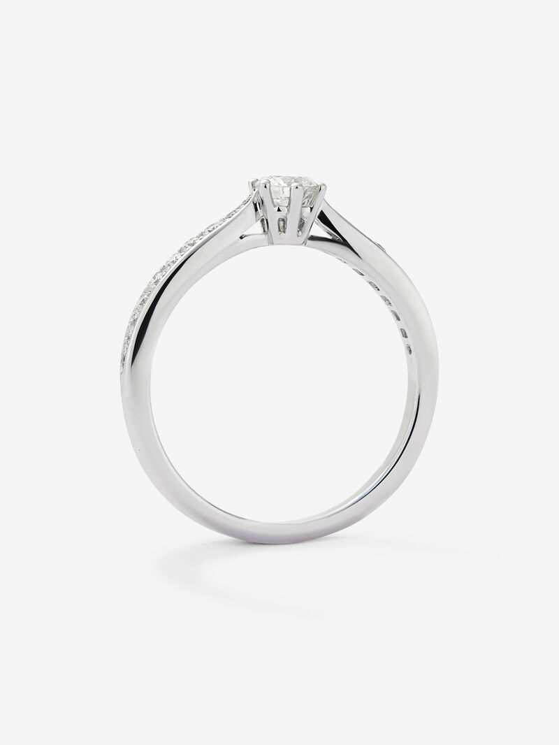 Solitaire ring in 18K white gold with a central 0.25-carat brilliant-cut diamond and additional diamonds totaling 0.13 cts image number 4