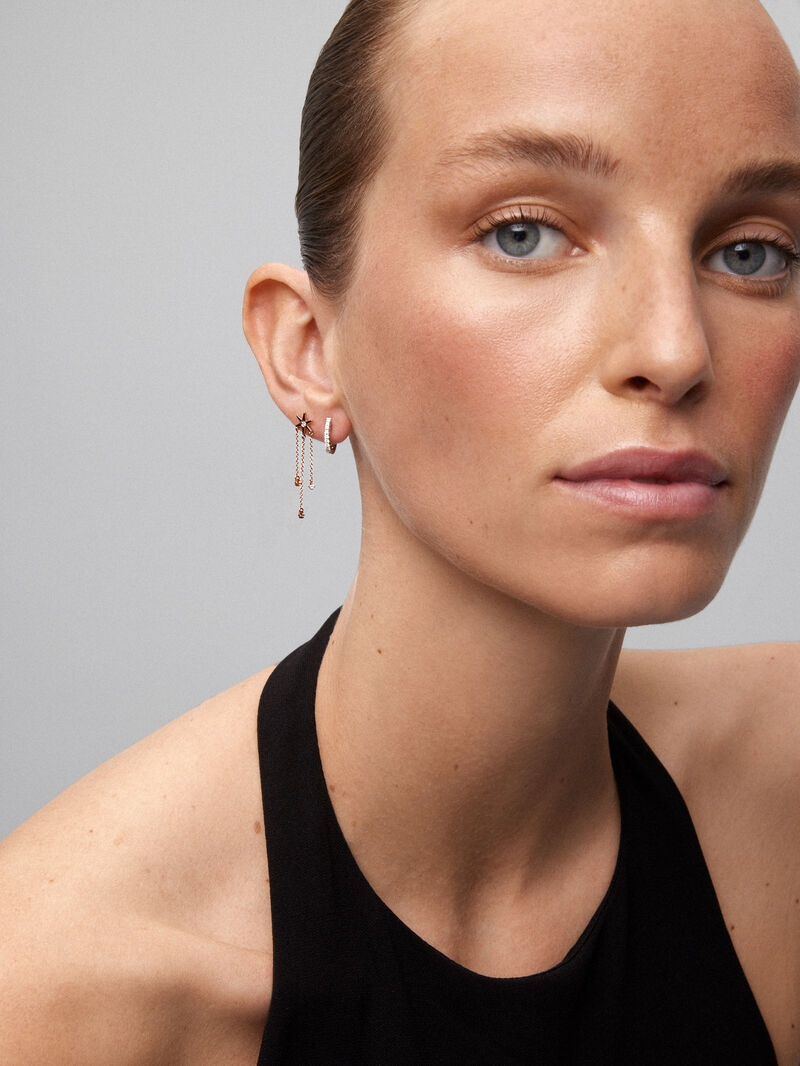 Single long drop earring of 18K rose gold star with diamonds. image number 0