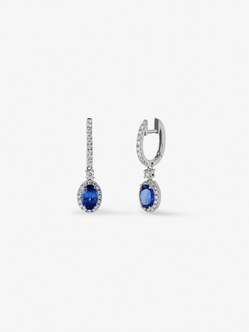 18K white gold earrings with 2 oval-cut blue sapphires with a total of 0.69 cts and 36 brilliant-cut diamonds with a total of 0.13 cts image number 0