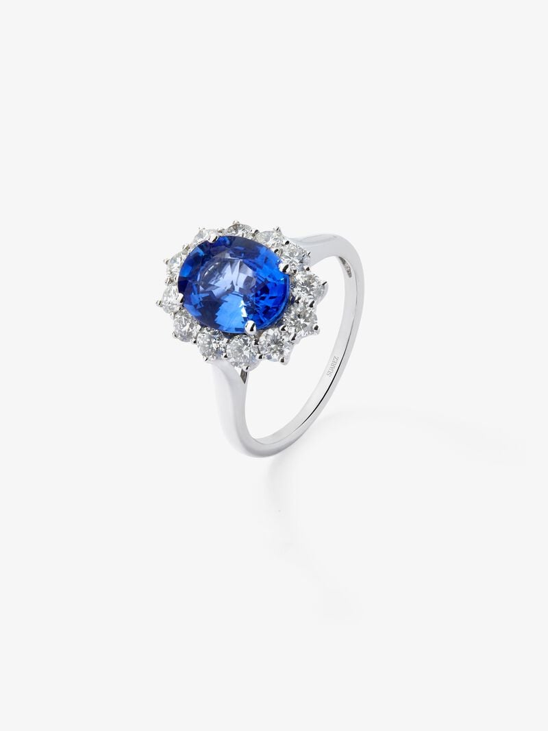 18K white gold ring with oval-cut royal blue sapphire of 2.33 cts and a border of 12 brilliant-cut diamonds with a total of 0.52 cts image number 0