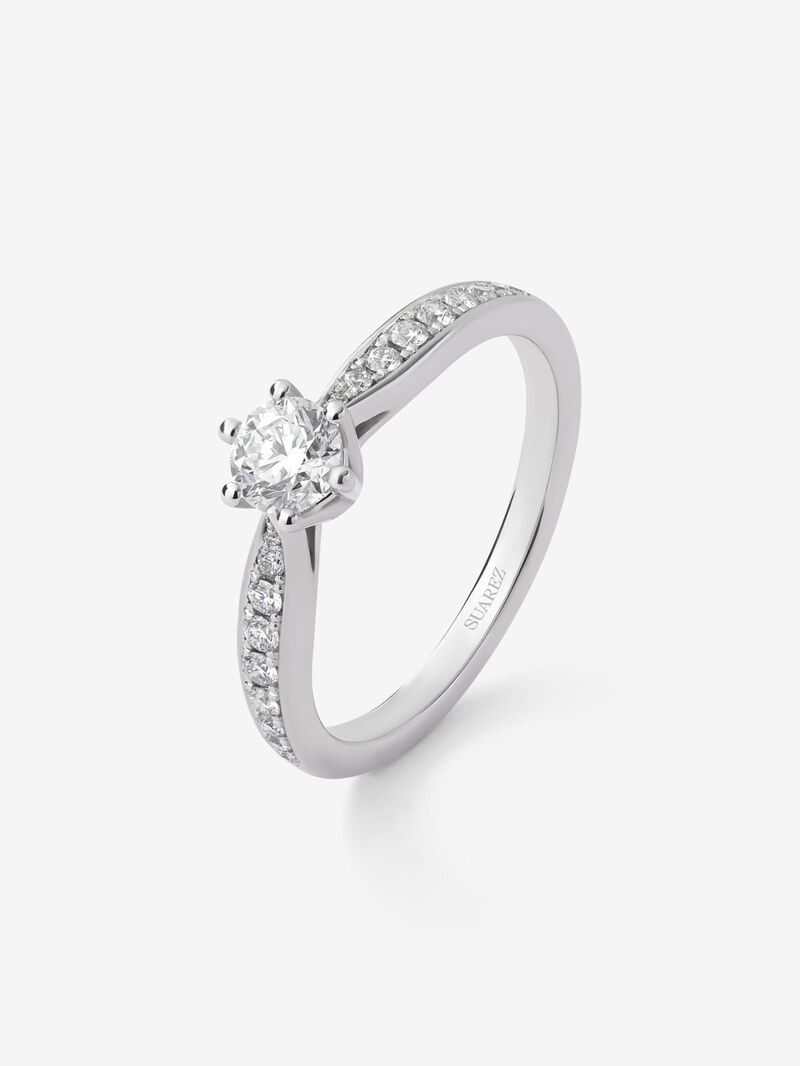 Solitaire ring in 18K white gold with a central 0.40-carat brilliant-cut diamond and additional diamonds totaling 0.19 cts image number 0