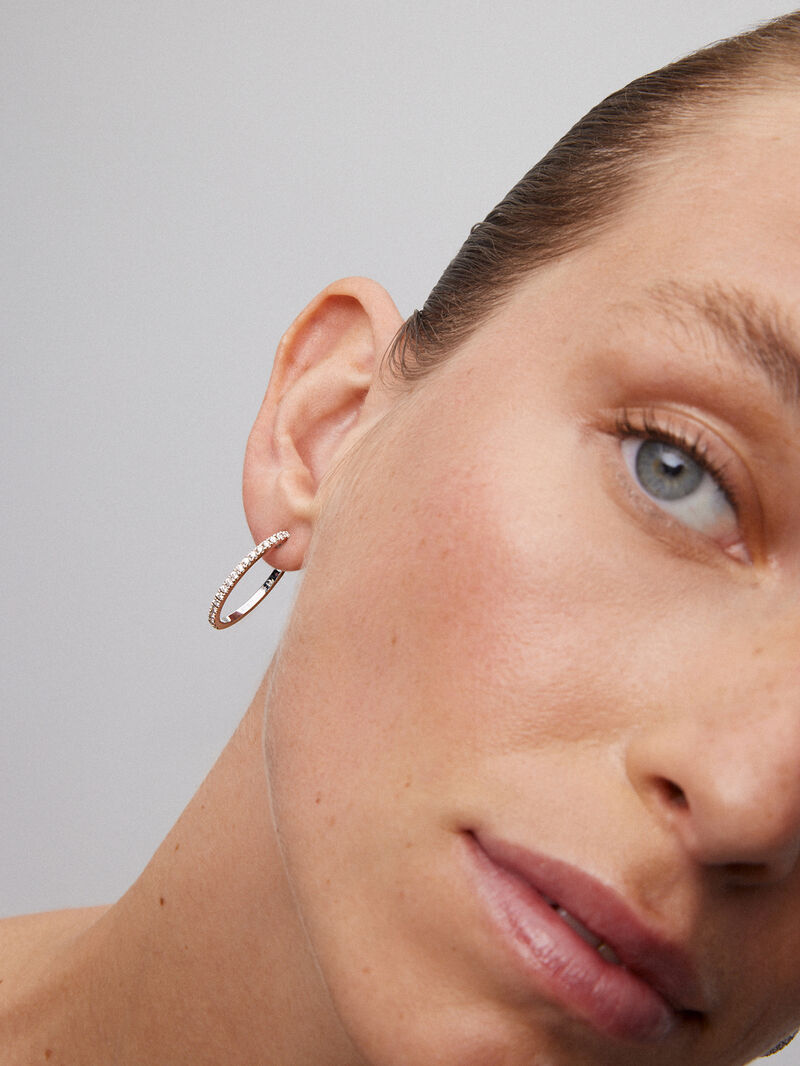Thin hoop earrings made of 18K white gold with diamonds. image number 1