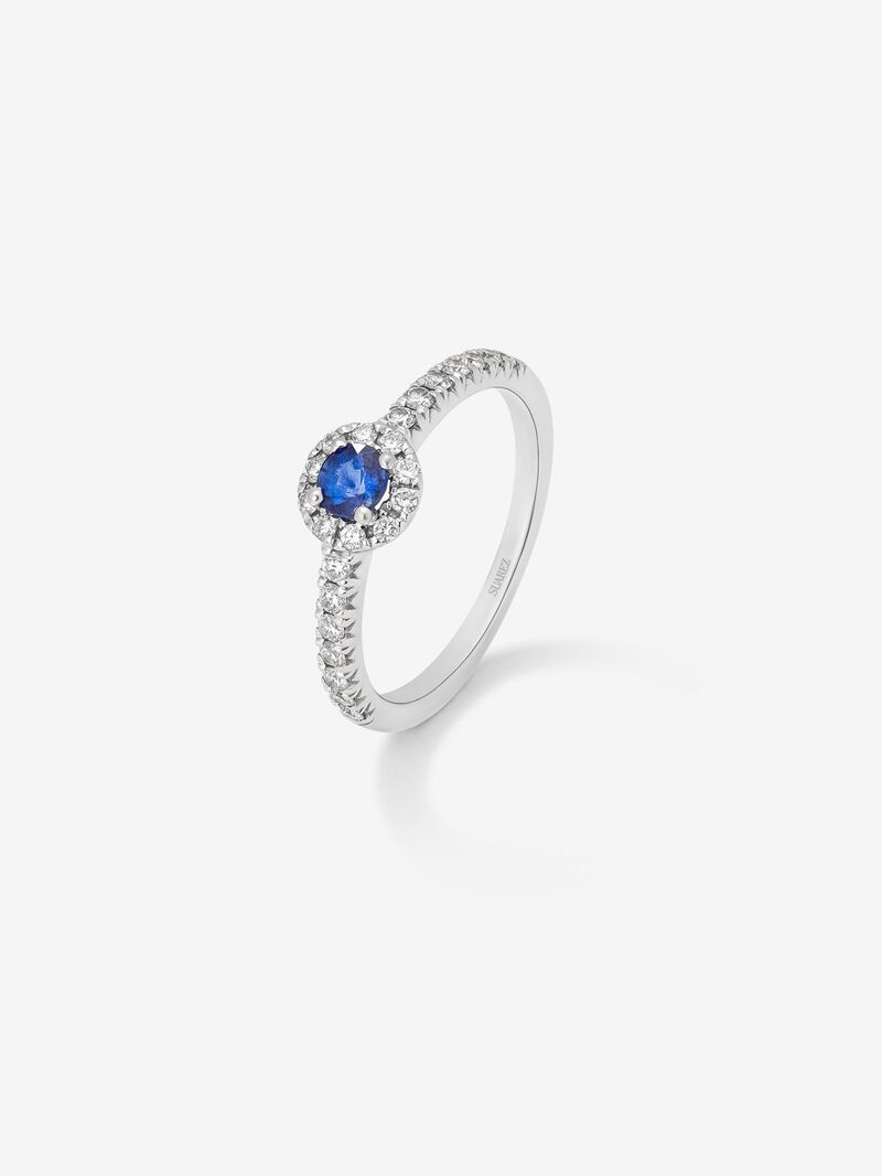 18K white gold ring with brilliant-cut blue sapphire of 0.4 cts and border and arm of 24 brilliant-cut diamonds with a total of 0.3 cts image number 0