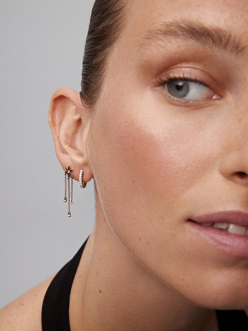 Single long drop earring of 18K rose gold star with diamonds. image number 1